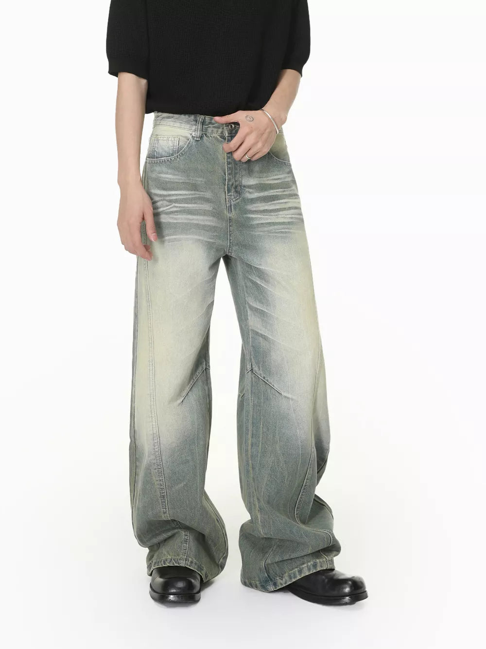 Men's wide leg jeans in light wash denim with a relaxed fit.