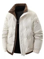 Beige padded puffer jacket with brown collar and trim, zip and button closure.