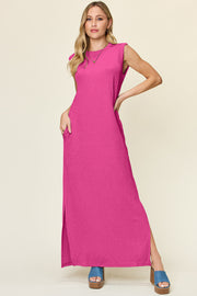 Textured ribbed maxi dress in hot pink with side slits and pockets.