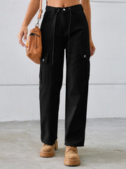 Black denim cargo pants with drawstring waist and buttoned flap pockets.