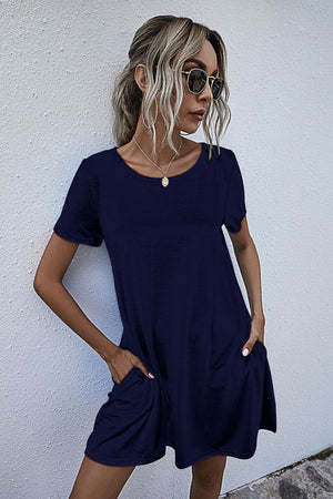 Dark blue relaxed pocketed tee dress with short sleeves and a scoop neckline.