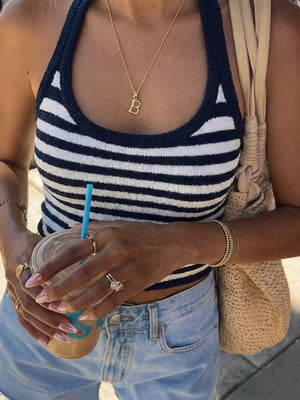 Chic striped halter cami top in blue and white knit with a cropped fit.