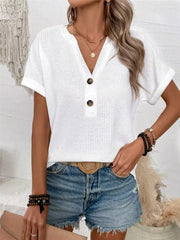 White waffle knit V-neck t-shirt with button detail and cuffed sleeves.