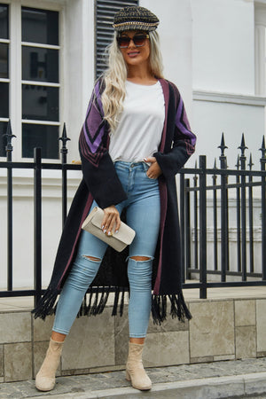 Long black cardigan with geometric purple trim and fringed hemline.