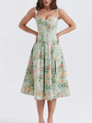 Floral midi dress in sage with a side slit and sweetheart neckline.