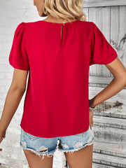 Red slit sleeve blouse with keyhole back and gold zipper detail.