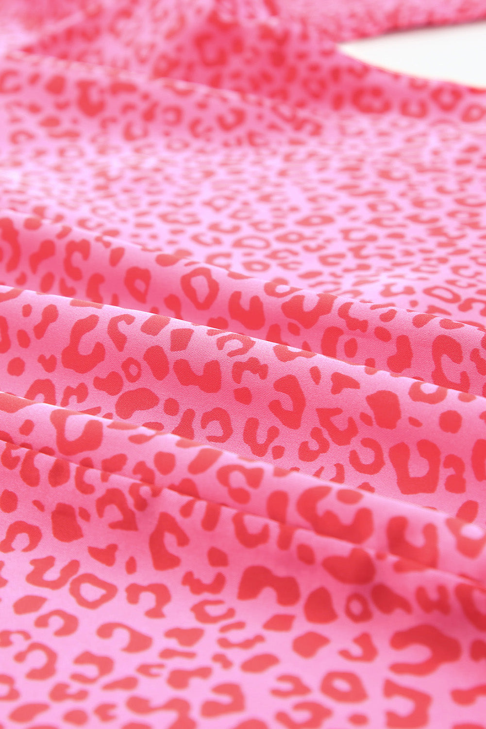 Pink leopard print blouse with smocked sleeves