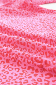 Pink leopard print blouse with smocked sleeves