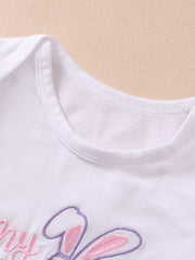 White cotton baby bodysuit with pink and purple bunny embroidery and text.