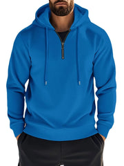 Blue waffle-knit quarter-zip hooded pullover with drawstring and zipper detail.