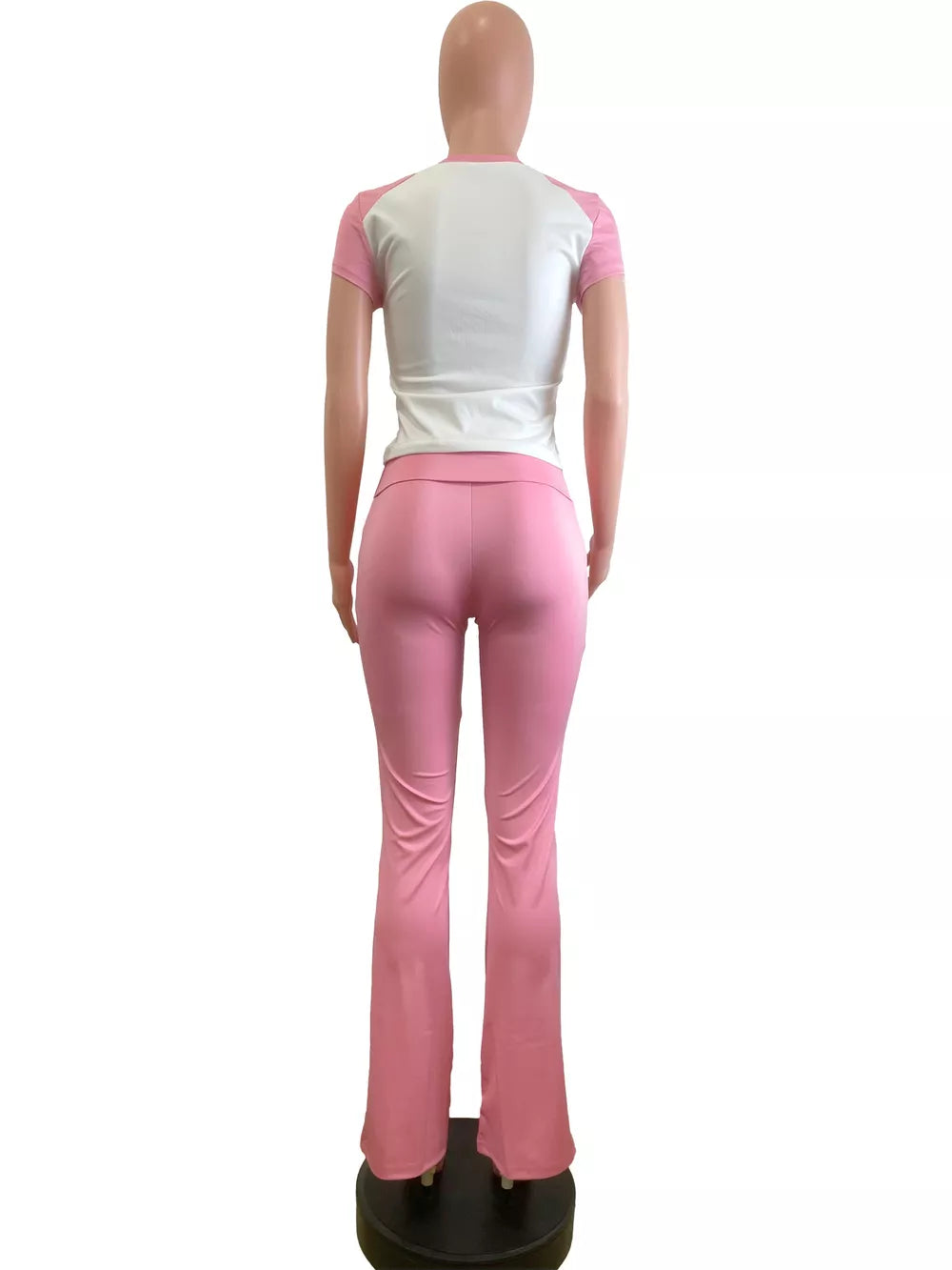 Pink and white contrast two-piece tee and flare pants set.