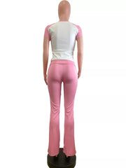 Pink and white contrast two-piece tee and flare pants set.
