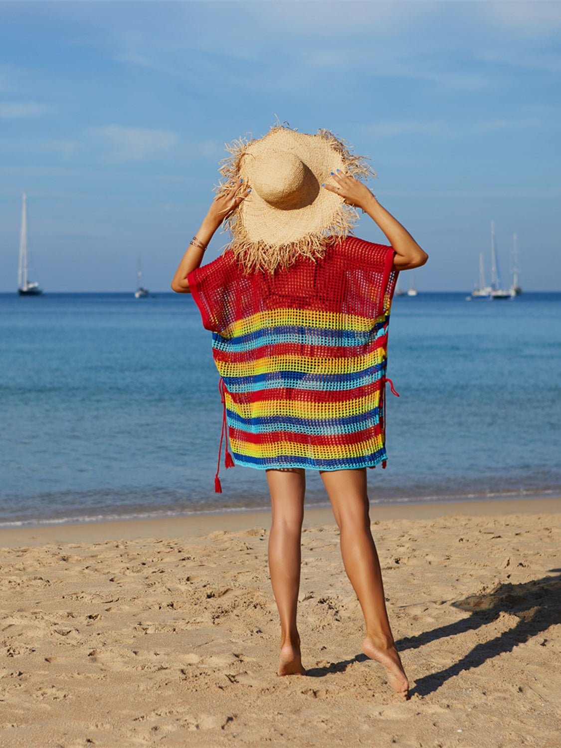 Rainbow stripe crochet beach poncho with red tassels and ties, polyester.