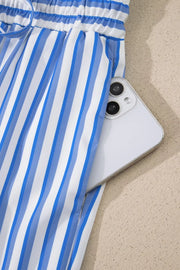 Blue and white striped maternity pants with pockets, showing a phone in the pocket.