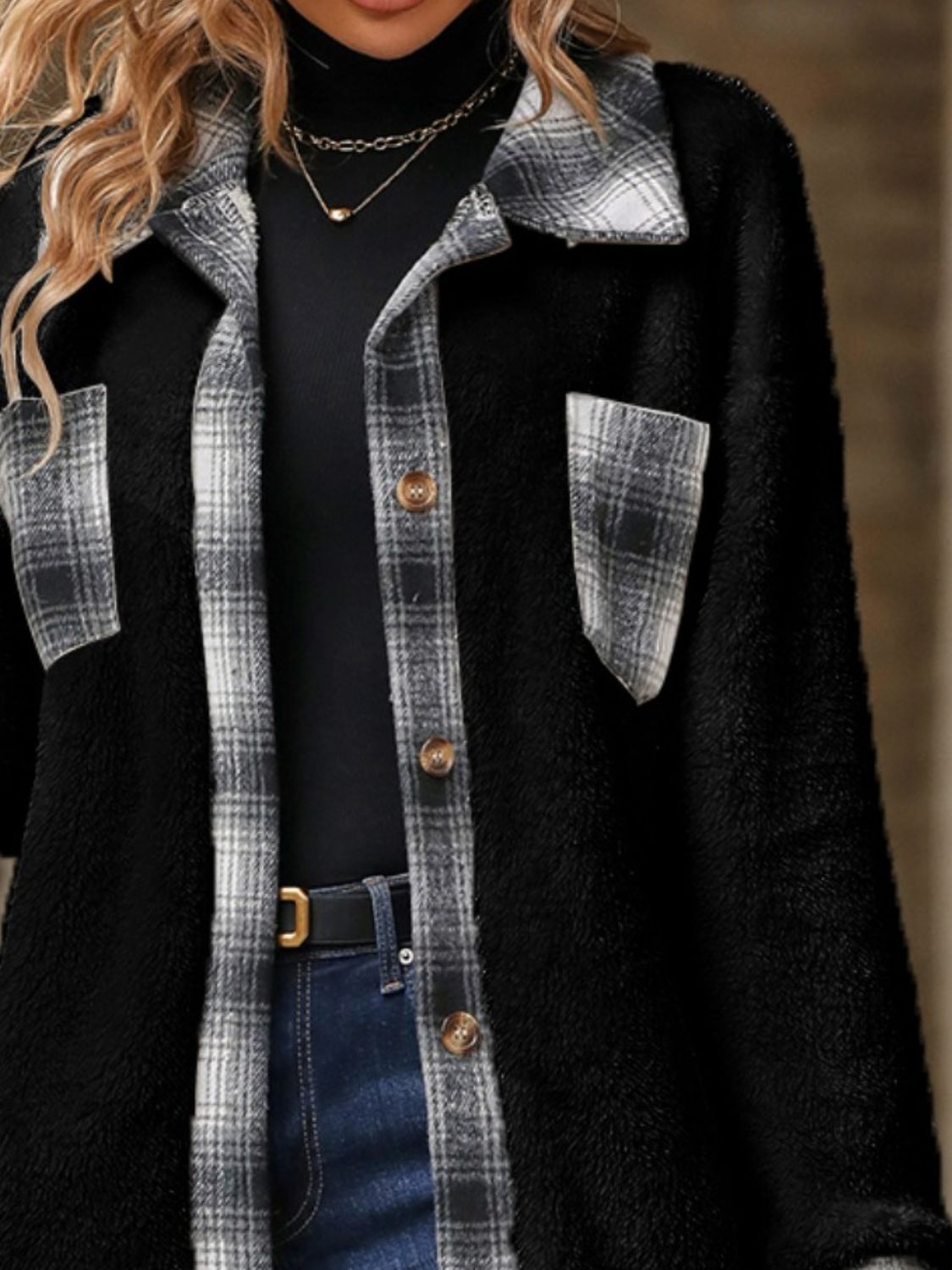Black teddy shacket with plaid collar, cuffs, and chest pockets.