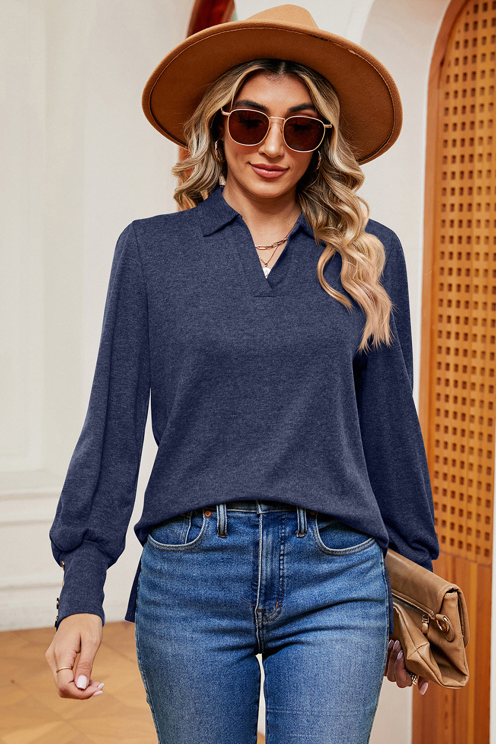 Dark blue buttoned blouse with collar and lantern sleeves