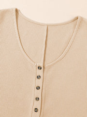 Waffle knit button-down romper in Camel with a scoop neckline and button details.