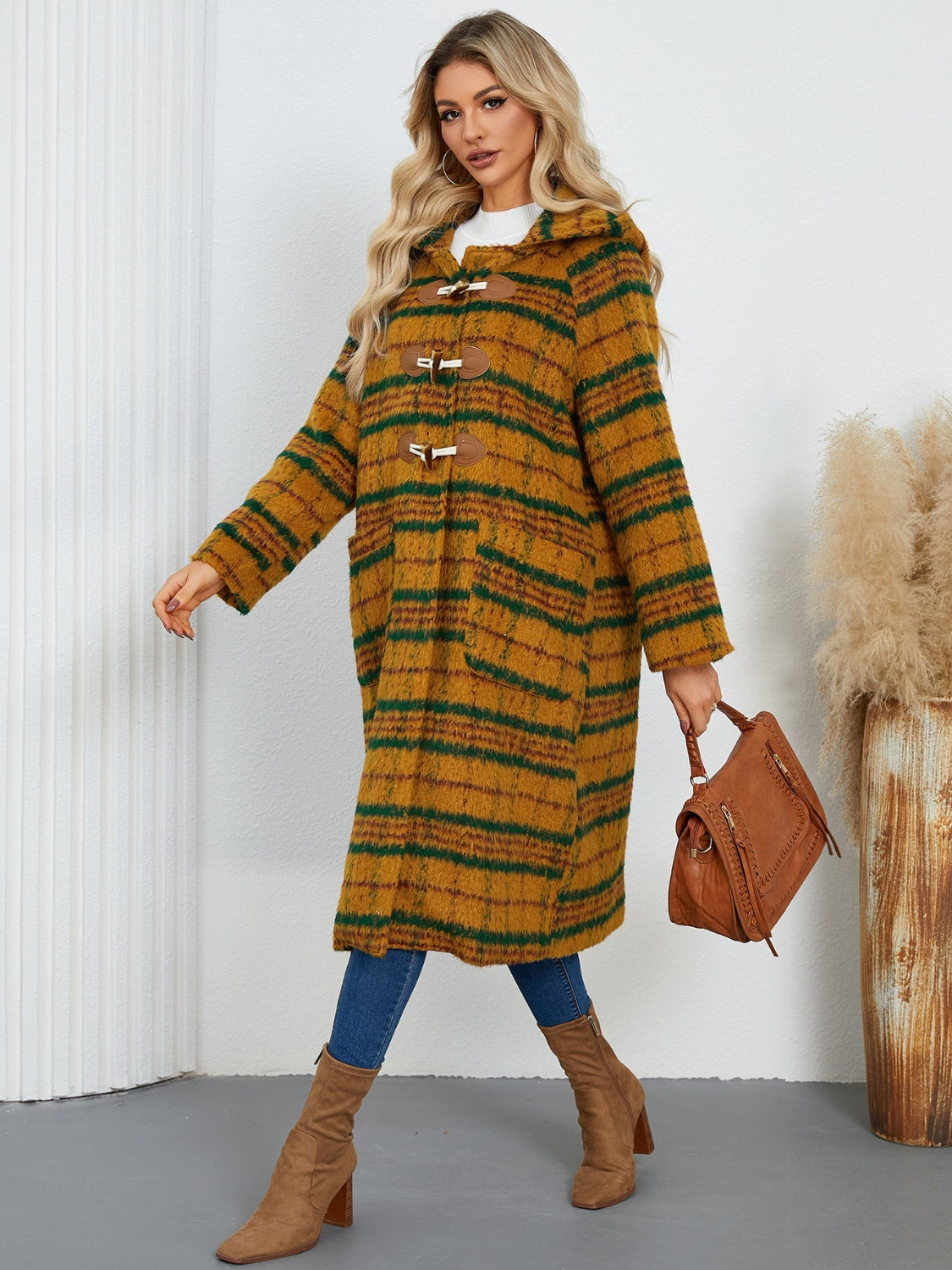 Tartan toggle hooded coat in mustard with green stripes, featuring toggle closures and pockets.