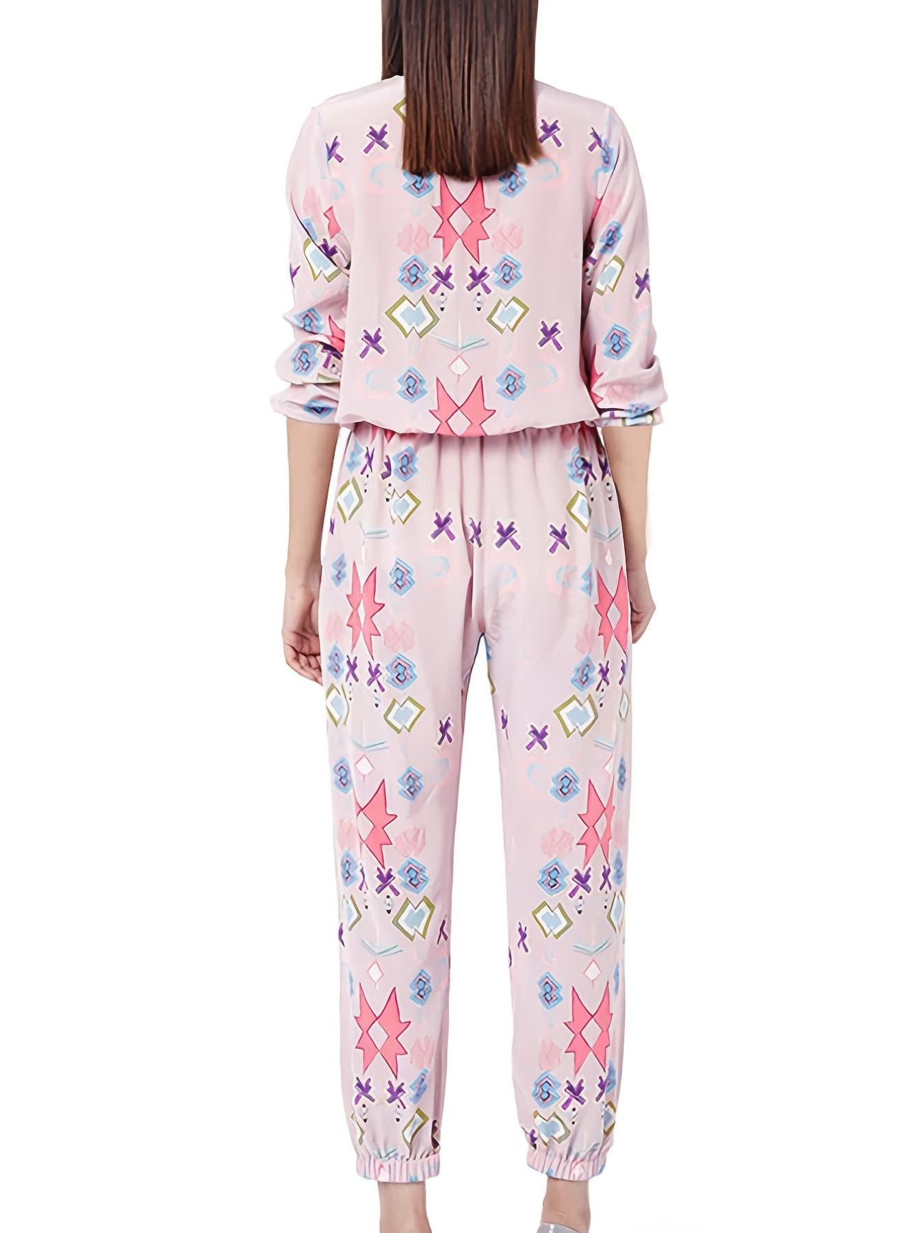 Women's blush pink abstract print loungewear set with crew neck top and pants.
