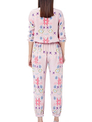 Women's blush pink abstract print loungewear set with crew neck top and pants.