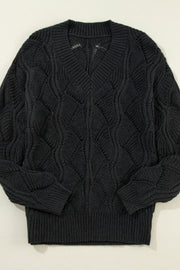 Black openwork knit V-neck pullover sweater with diamond pattern detail.
