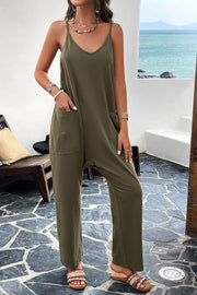 Army green relaxed drape pocket jumpsuit with V-neck and spaghetti straps.