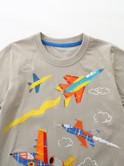 Toddler boys' tan cotton tee with colorful embroidered airplanes and clouds.