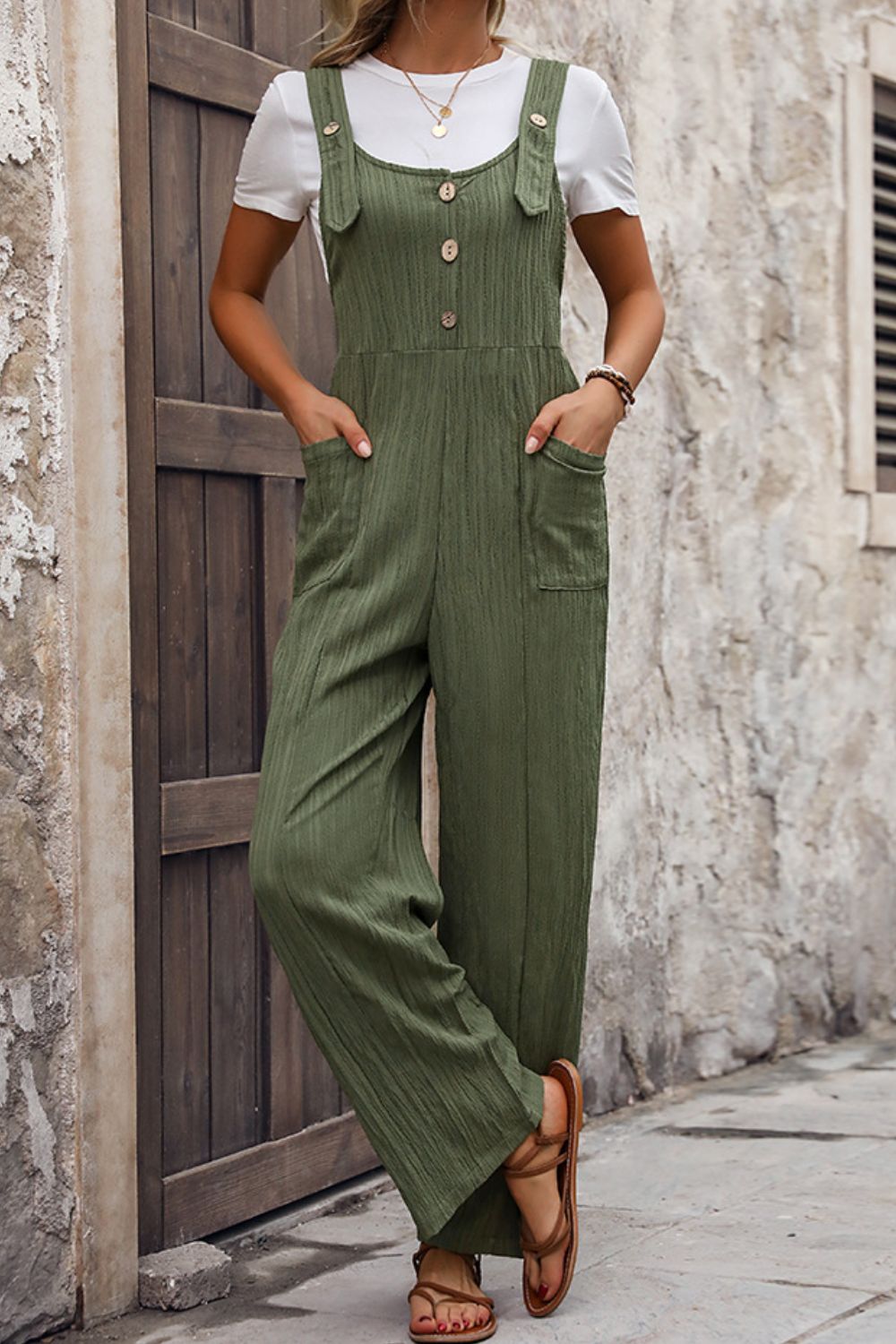 Textured linen button-front jumpsuit in matcha green with wide legs and pockets