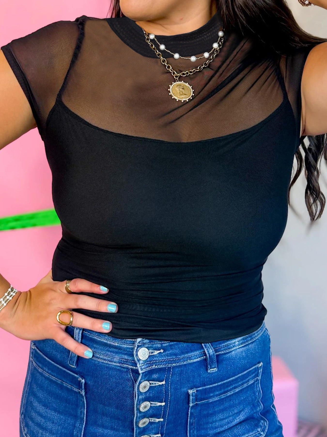 Black sheer mesh cap sleeve t-shirt with a scoop neck cami underneath.
