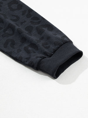 Dark gray pajama set with subtle leopard print and ribbed cuffs