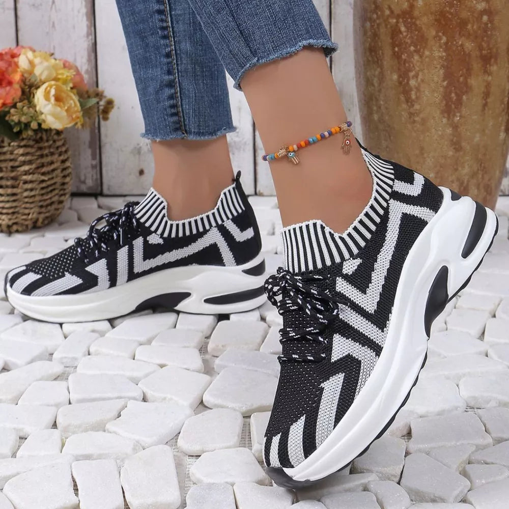 Geometric knit platform sneakers in black and white with white soles.