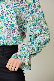 Blouse with painterly abstract print in blue and green, featuring gathered sleeves.