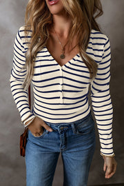 Ribbed stripe henley top with button detail in cream and navy, v-neck, long sleeves.