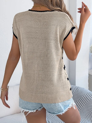 Khaki cable knit sleeveless sweater with black trim and side detail.