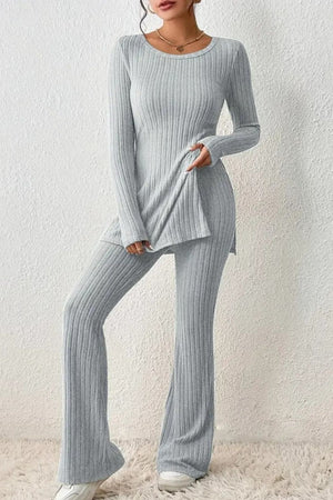 Light gray ribbed knit co-ord set with flared pants and side slit tunic.