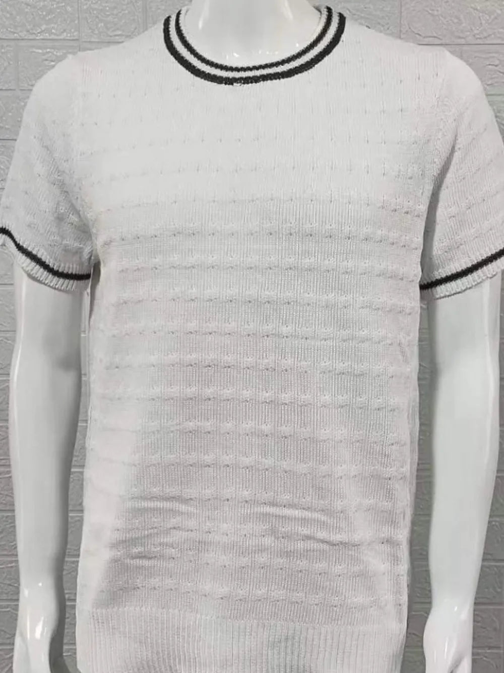 White textured knit t-shirt with black striped neckline and sleeves