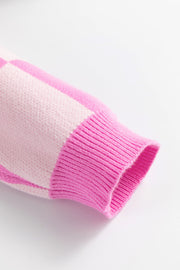Checkered polo knit sweater in fuchsia pink with ribbed cuffs and collar detail.