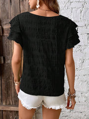 Black textured smocked blouse with ruffle sleeves, 100% polyester