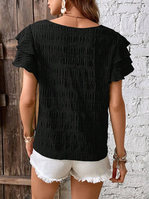 Black textured smocked blouse with ruffle sleeves, 100% polyester