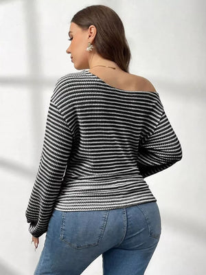 Black and white striped maternity t-shirt with one-shoulder neckline and long sleeves.