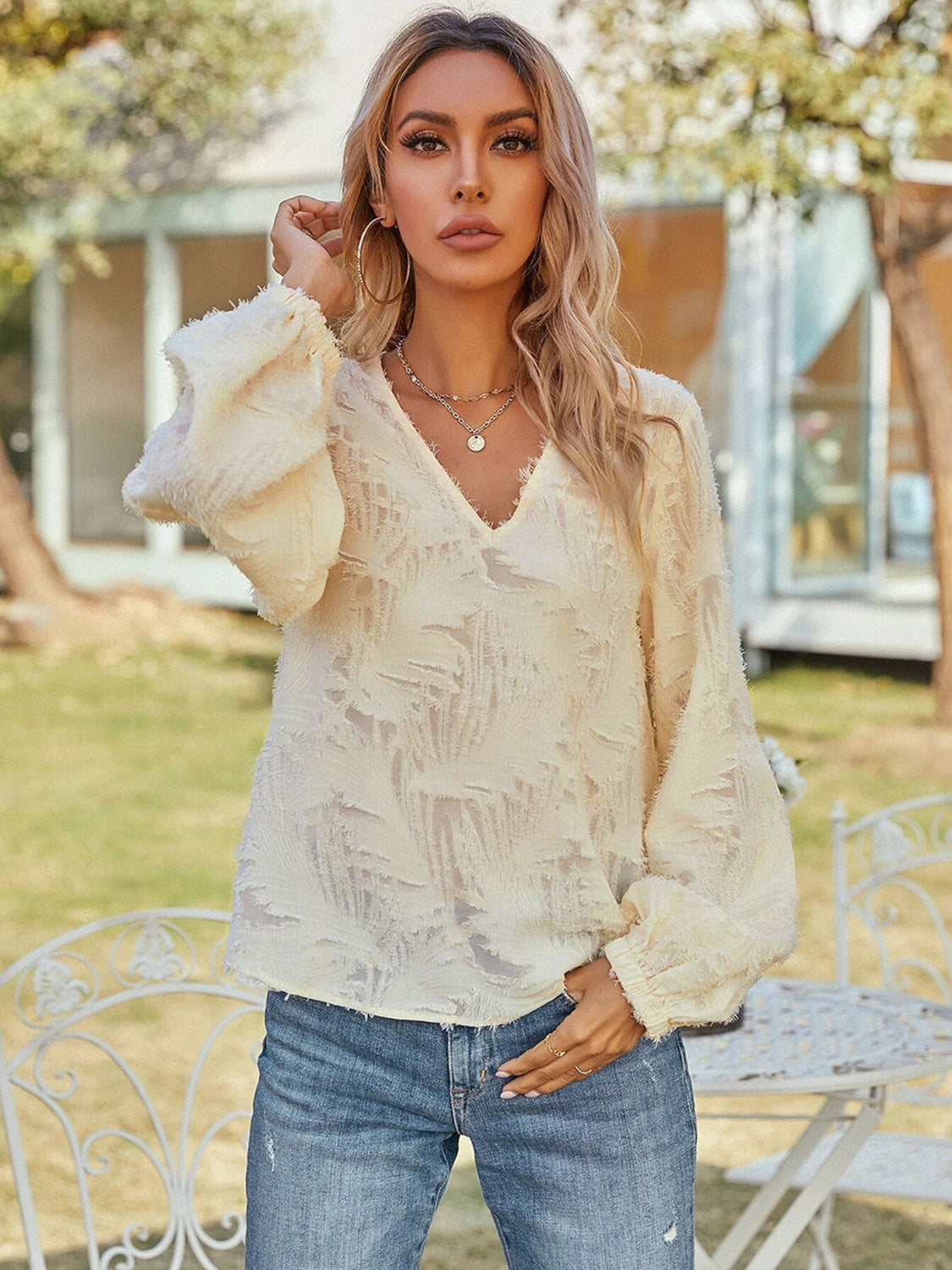 Cream textured puff sleeve v-neck blouse with balloon sleeves