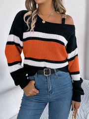 Asymmetric stripe knit sweater with shoulder detail, featuring black, orange, and white stripes.