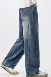 Men's blue vintage wash wide-leg denim jeans with a relaxed fit.