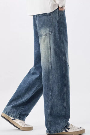 Men's blue vintage wash wide-leg denim jeans with a relaxed fit.