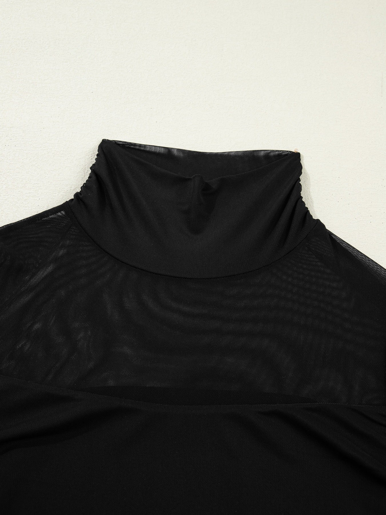 Black sheer mesh maternity shirt with a ruched high neck.