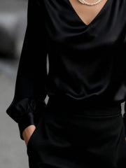 Black satin V-neck long sleeve blouse with gathered cuffs