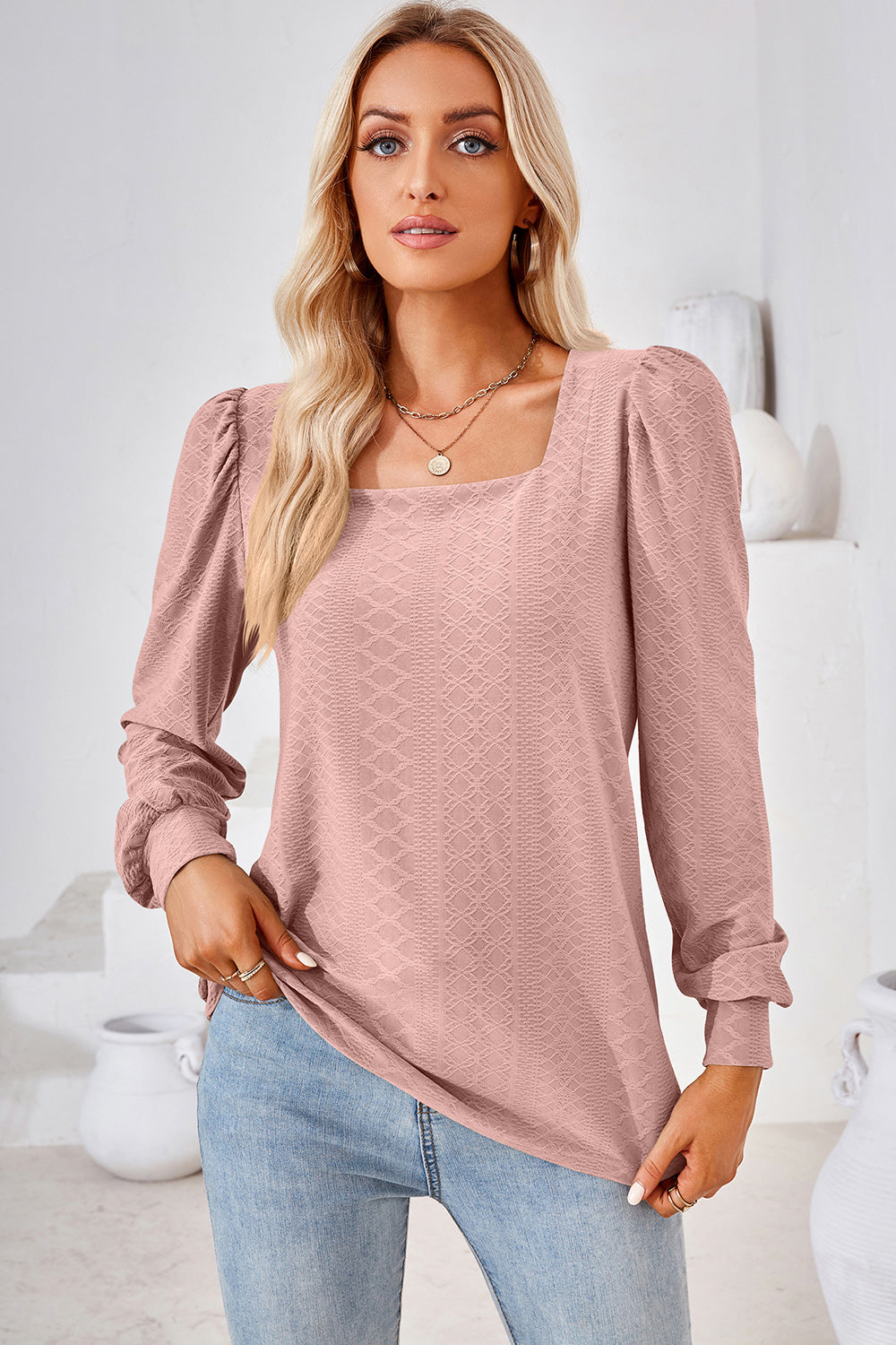 Blush pink diamond-textured puff sleeve top with square neckline.