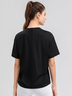 Black performance t-shirt with seam detail and short sleeves.