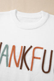 White crewneck sweater with embroidered colorful "Thankful" text detail