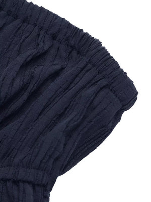 Navy blue textured peplum tube top and wide-leg pants set detail